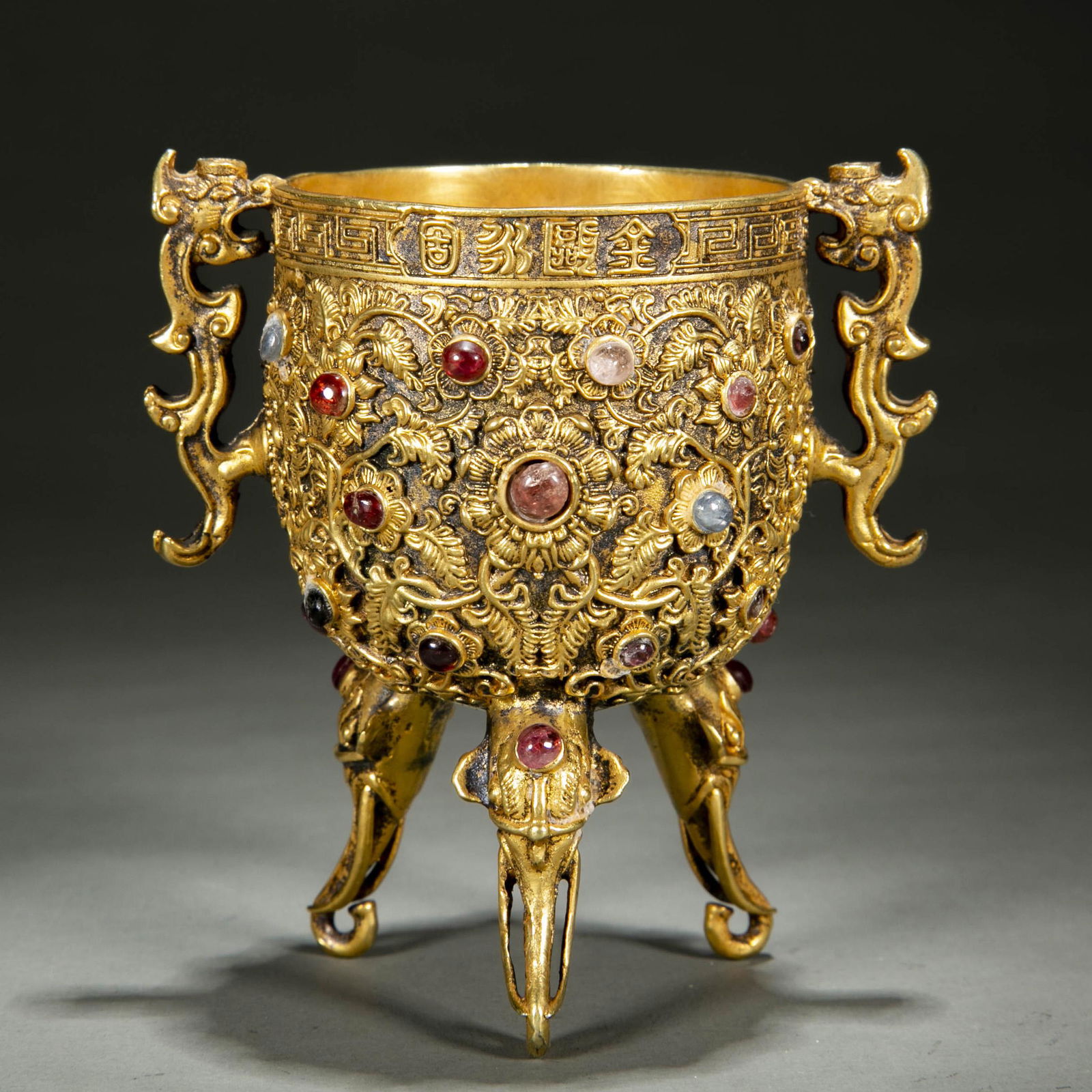 A GILT BRONZE BLESSING CUP "YONGGUBEI". (1 of 9)