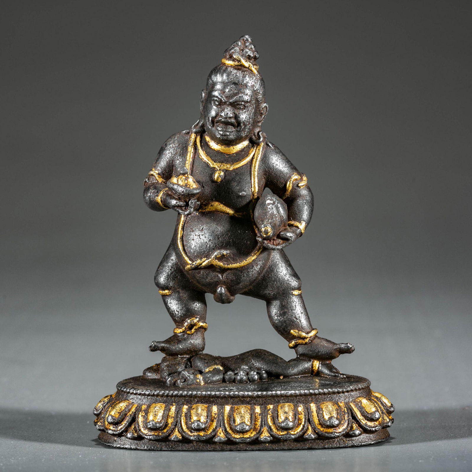 A Gilt Cast Iron God Of Wealth Buddha Statue.