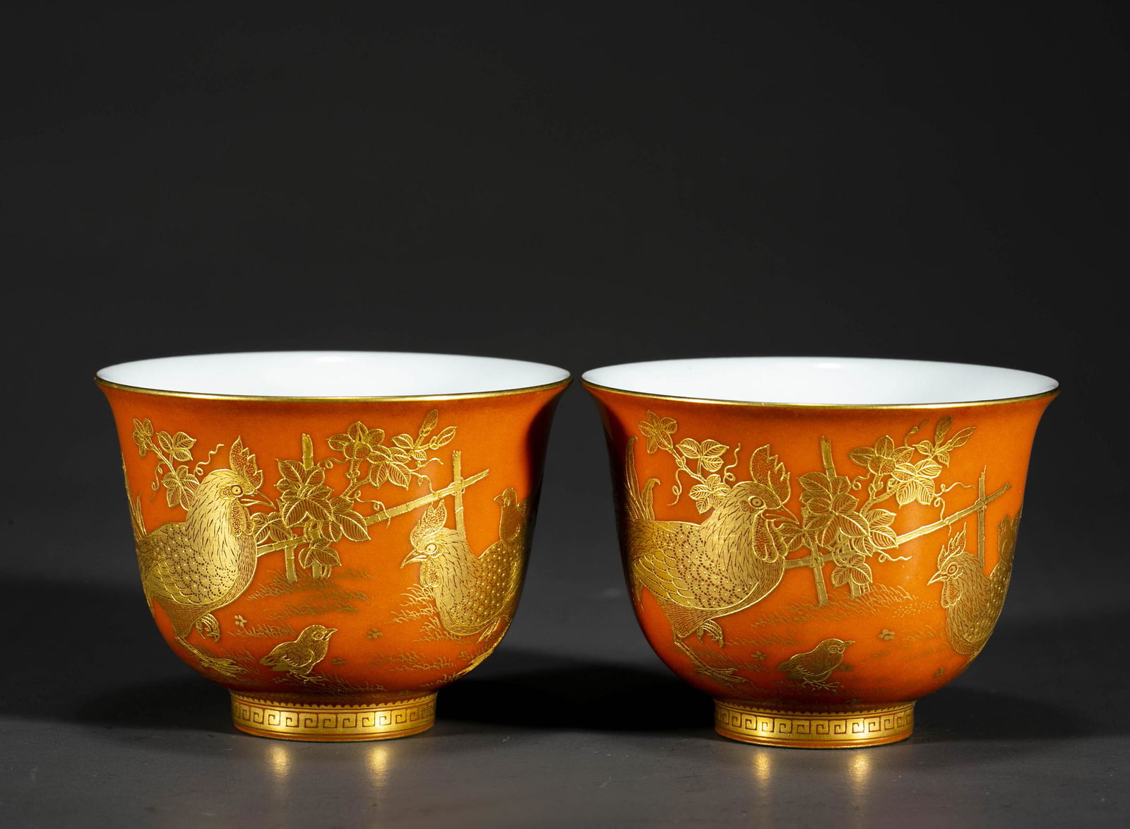 A SET OF CORAL-RED PORCELAIN CUPS.: A Set of Coral-Red Porcelain Cups, with Golden Rooster, Hen and Chicks Design, Symbolize Reunion.