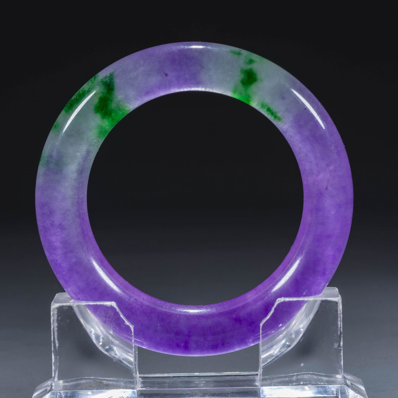 A JADEITE BANGLE.: Jadeite Bangle.