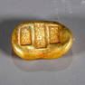 A GILT BRONZE COIN.