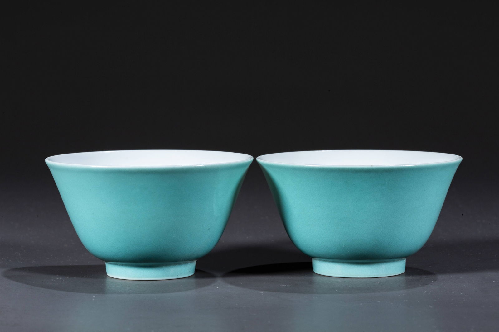 A PAIR OF TURQUOISE GLAZED PORCELAIN CUPS.: A Pair of Turquoise Glazed Porcelain Cups.