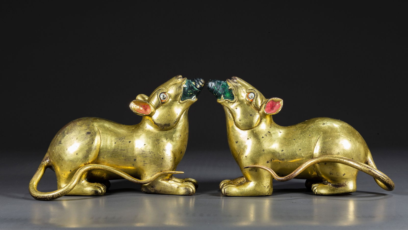 A SET OF TIBETAN GILT BRONZE MOUSE STATUES. (1 of 8)
