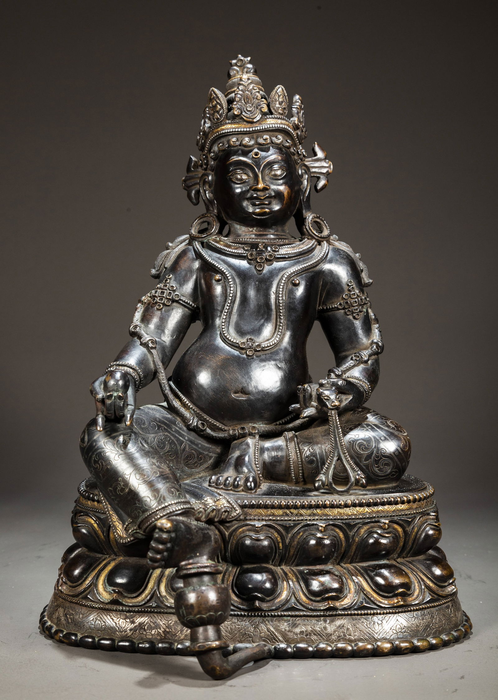 A BLACK LACQUER YELLOW GOD OF WEALTH STATUE.: Black Lacquer Bronze Yellow God of Wealth Buddha Statue, Inlaid with Gold and Silver.