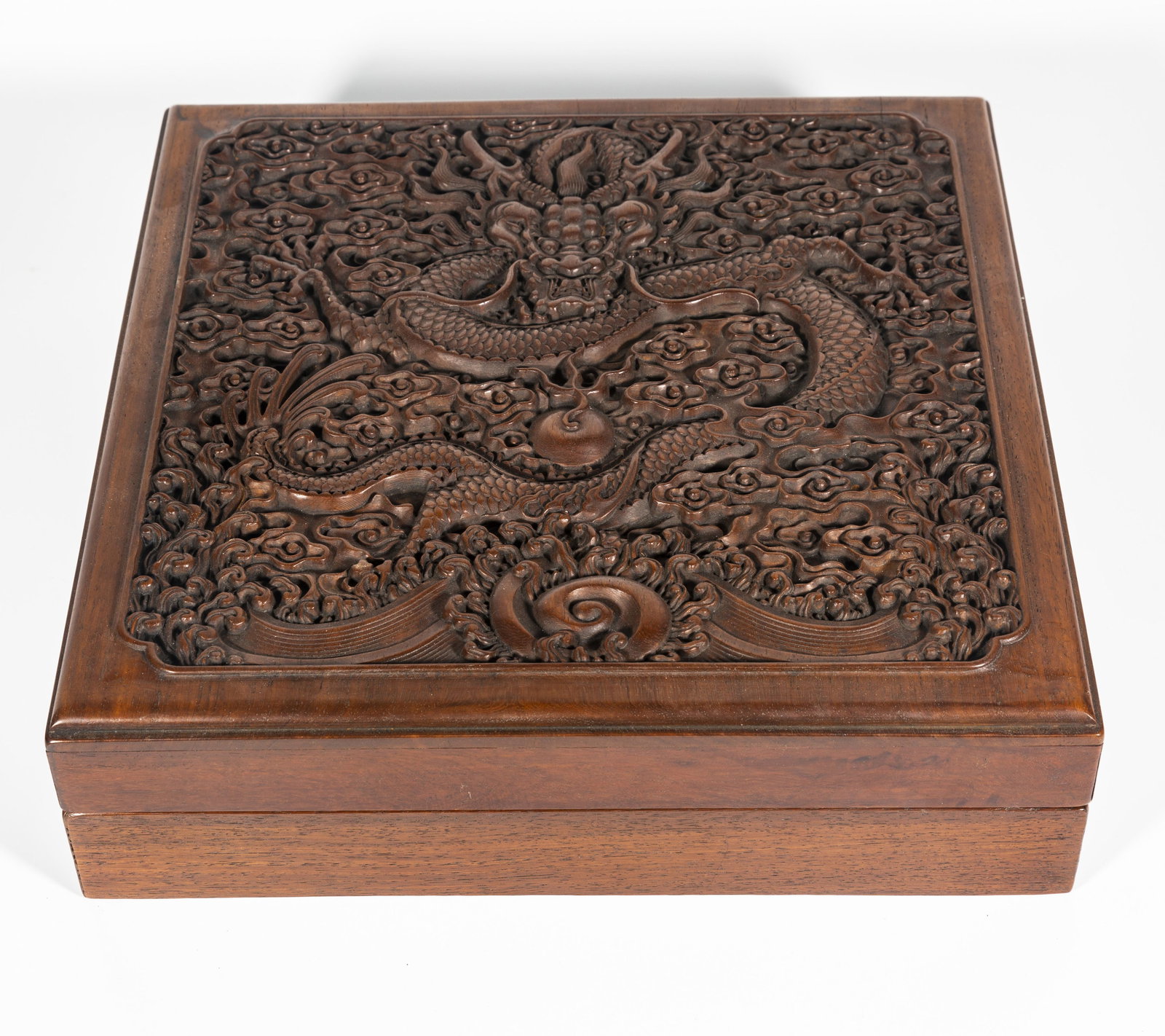 A HUANGHUALI WOOD BOX, CARVED DRAGON DESIGN. (1 of 8)