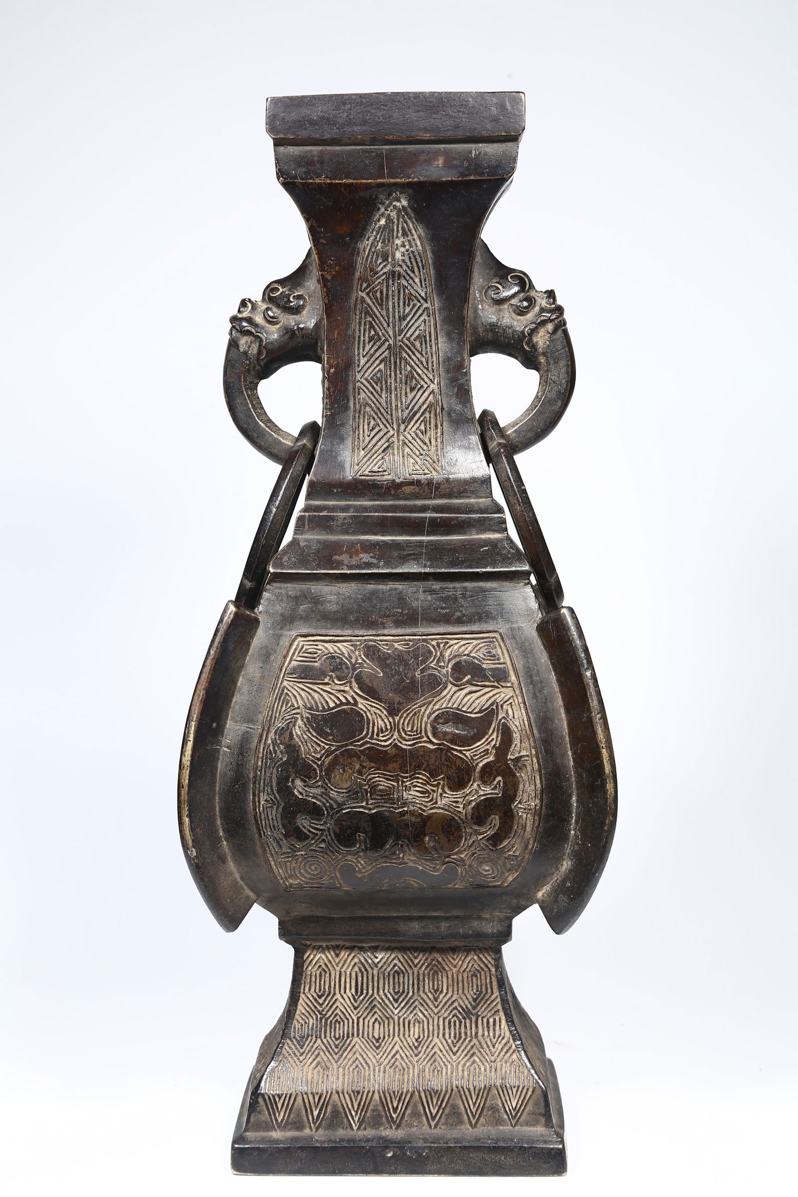A BRONZE BOTTLE WITH BEAST FACE DESIGN. (1 of 9)