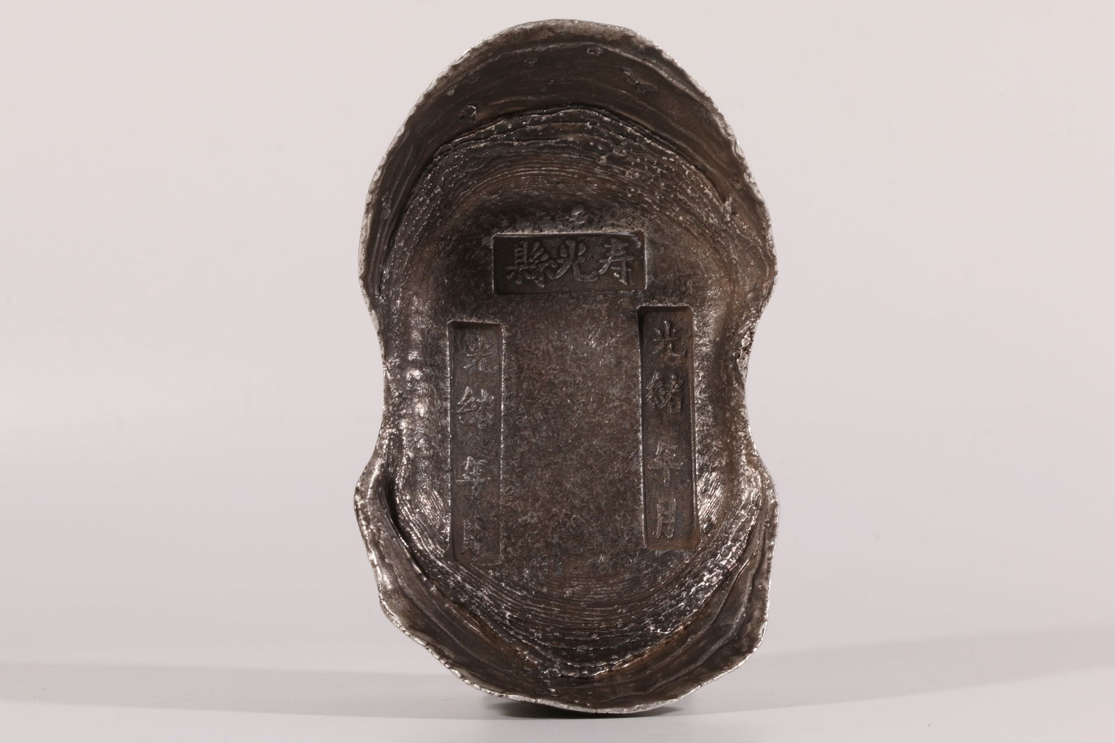 A SILVER INGOT (FIFTY TAELS) (1 of 10)