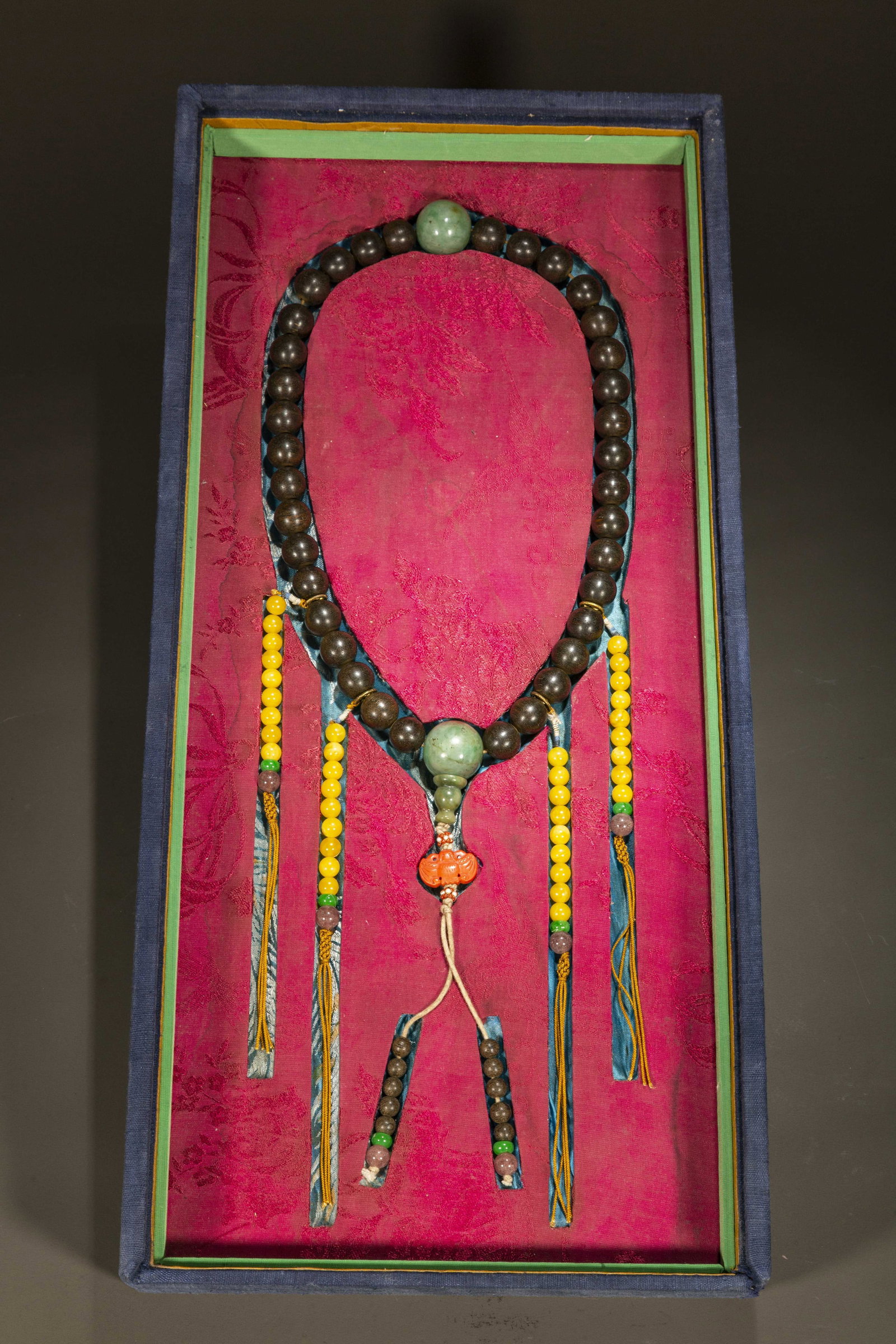 A STRING OF HANDHELD AQUILARIA CRASSNA BEADS.: A String of Handheld Aquilaria Crassna Beads.