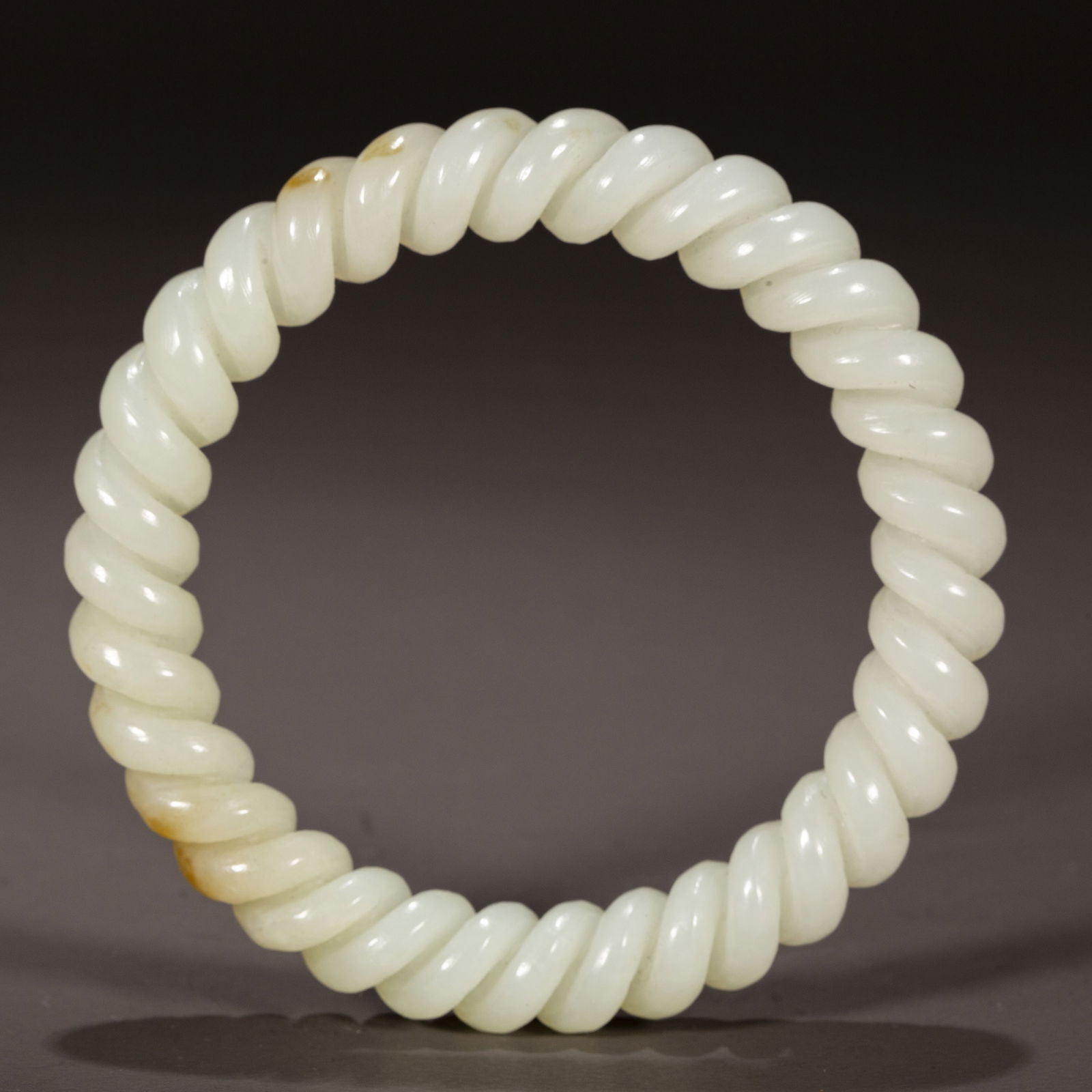 A HETIAN JADE MULTI-STRAND BANGLE. (1 of 5)