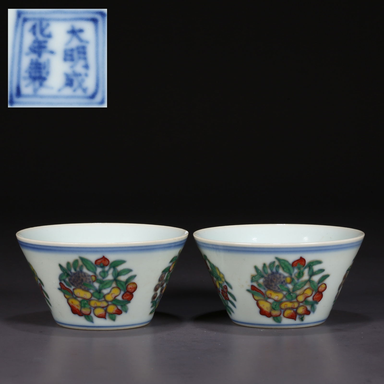 A SET OF HOOF-SHAPED PORCELAIN CUPS.: A Set of Contrasting-Color Hoof-Shaped Porcelain Cups, with Flowers and Fruits Design.