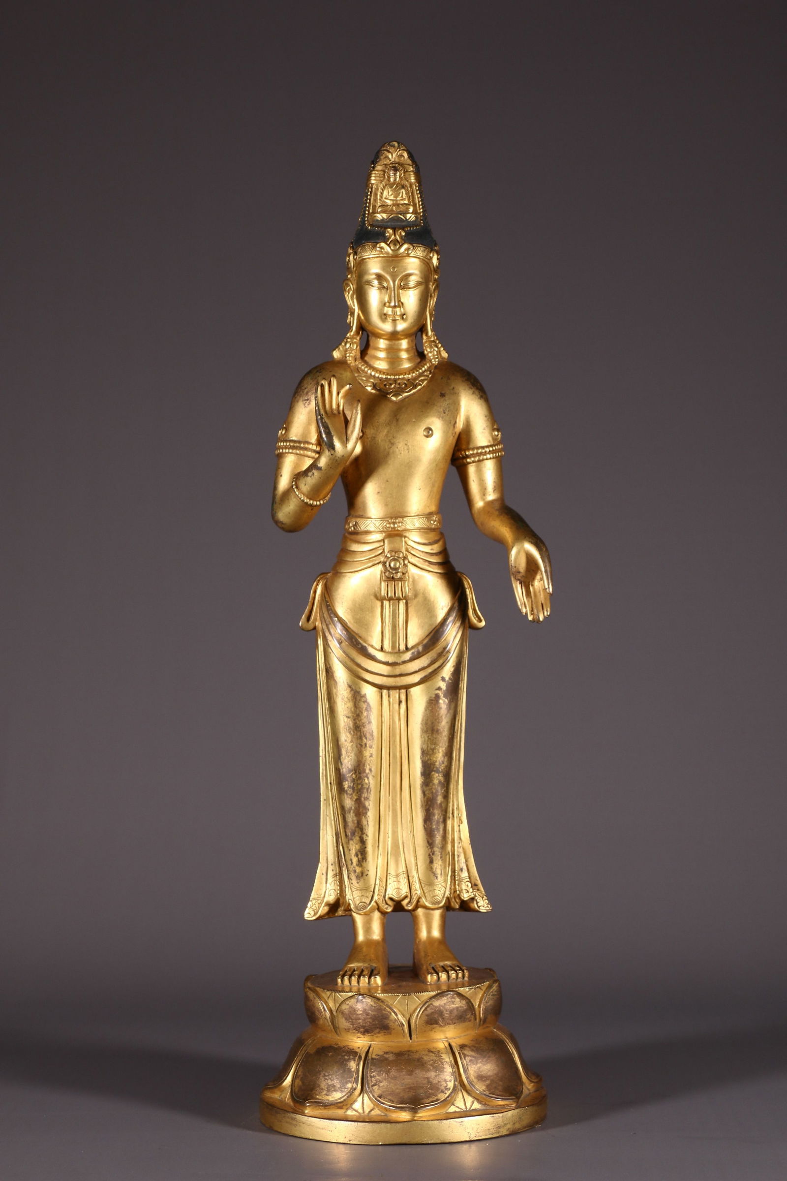 A GILT BRONZE ACARYA AVALOKITESVARA STATUE. (1 of 10)