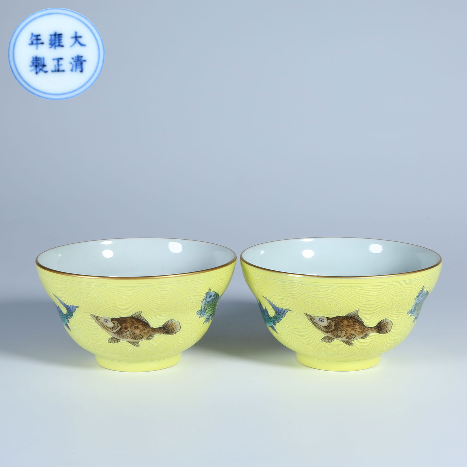 A SET OF YELLOW-GLAZED MULTICOLORED CUPS WITH FISH PATTERN AND WAISTED SHAPE: Set of Yellow-Glazed Multicolored Cups with Fish Pattern and Waisted Shape