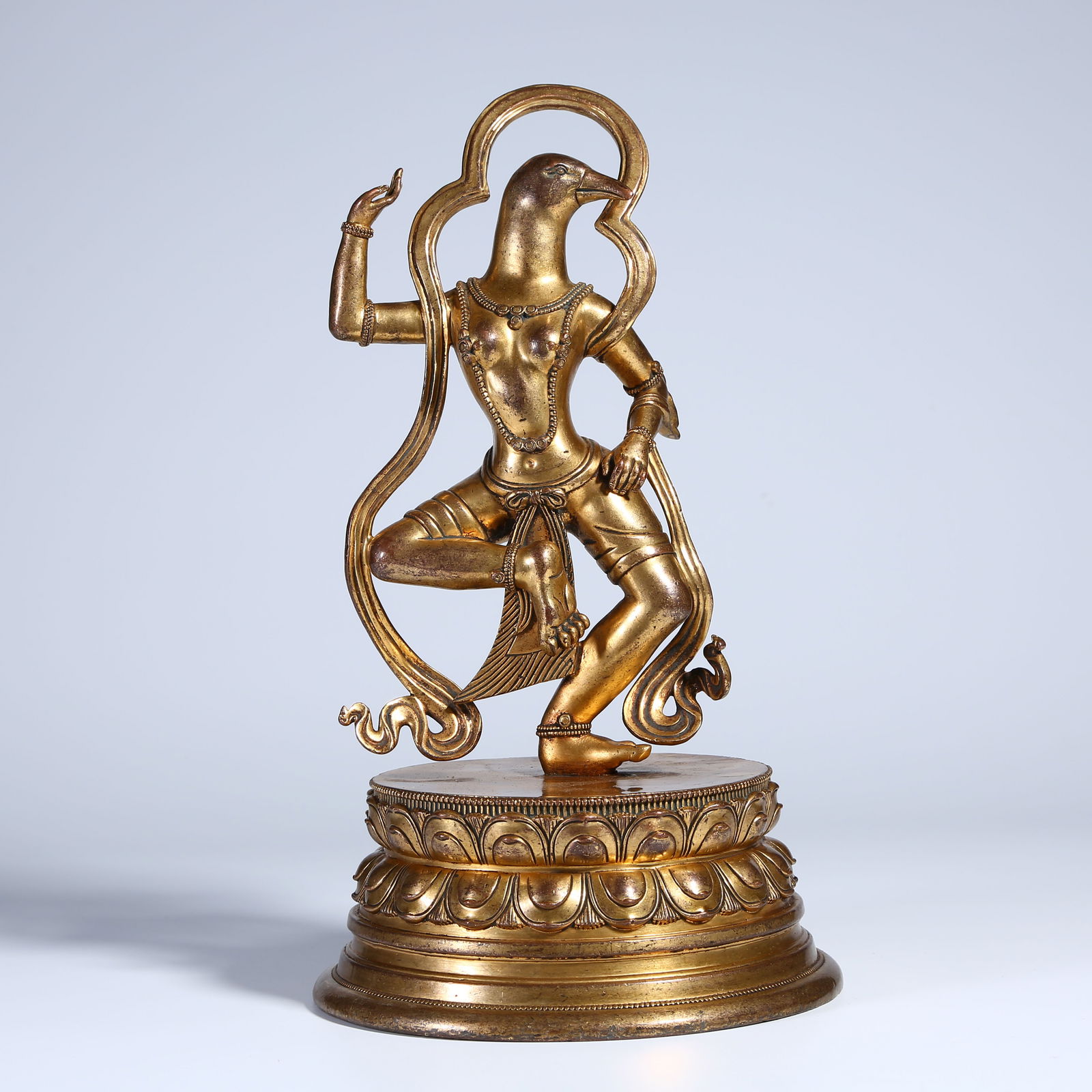 A GILT BRONZE KURUKULLA STATUE WITH A PIGEON-HEAD MOTIF (1 of 9)