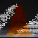 A COPPER GILDED FOUR-ARMED AVALOKITESHVARA SITTING STATUE