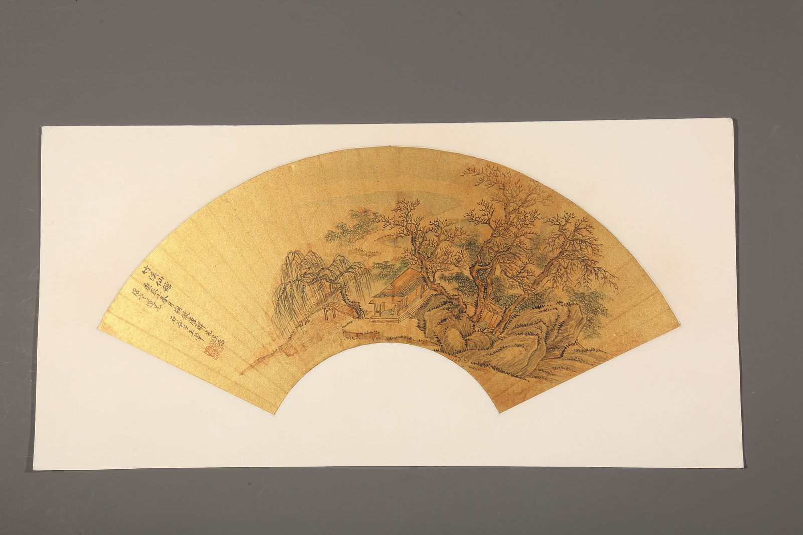 A PAPER FAN LEAF OF LANDSCAPE BY WANG HUI (MOUNTED AS A MIRROR HEART).王翬: Paper Fan Leaf of Landscape by Wang Hui (Mounted as a Mirror Heart).王翬