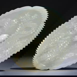 A HETIAN JADE MIRROR WITH CLOUD AND DRAGON DESIGN: Hetian jade mirror with cloud and dragon design