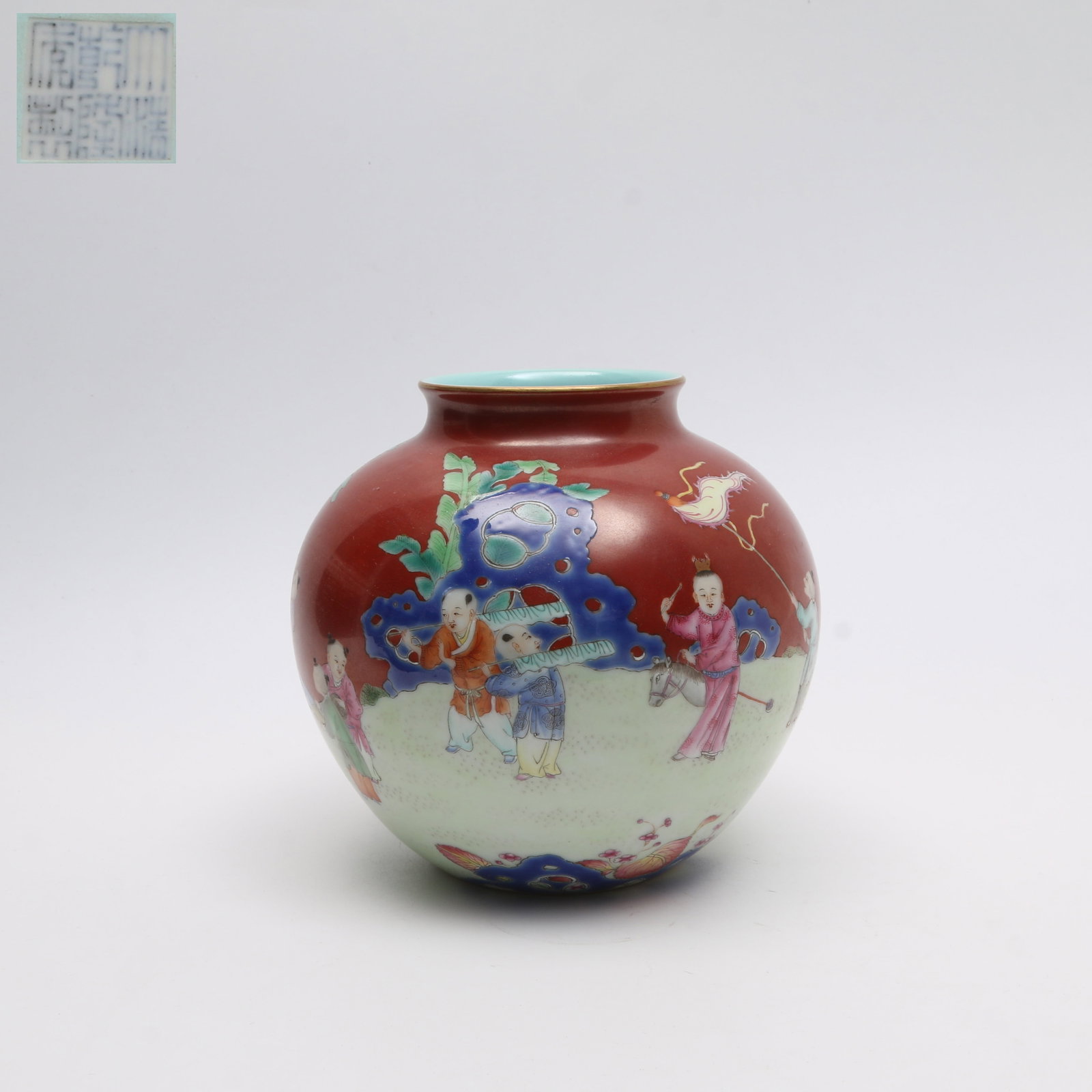 A FAMILLE ROSE JAR WITH "CHILDREN AT PLAY" MOTIF ON RED GROUND: Famille rose jar with "Children at Play" motif on red ground