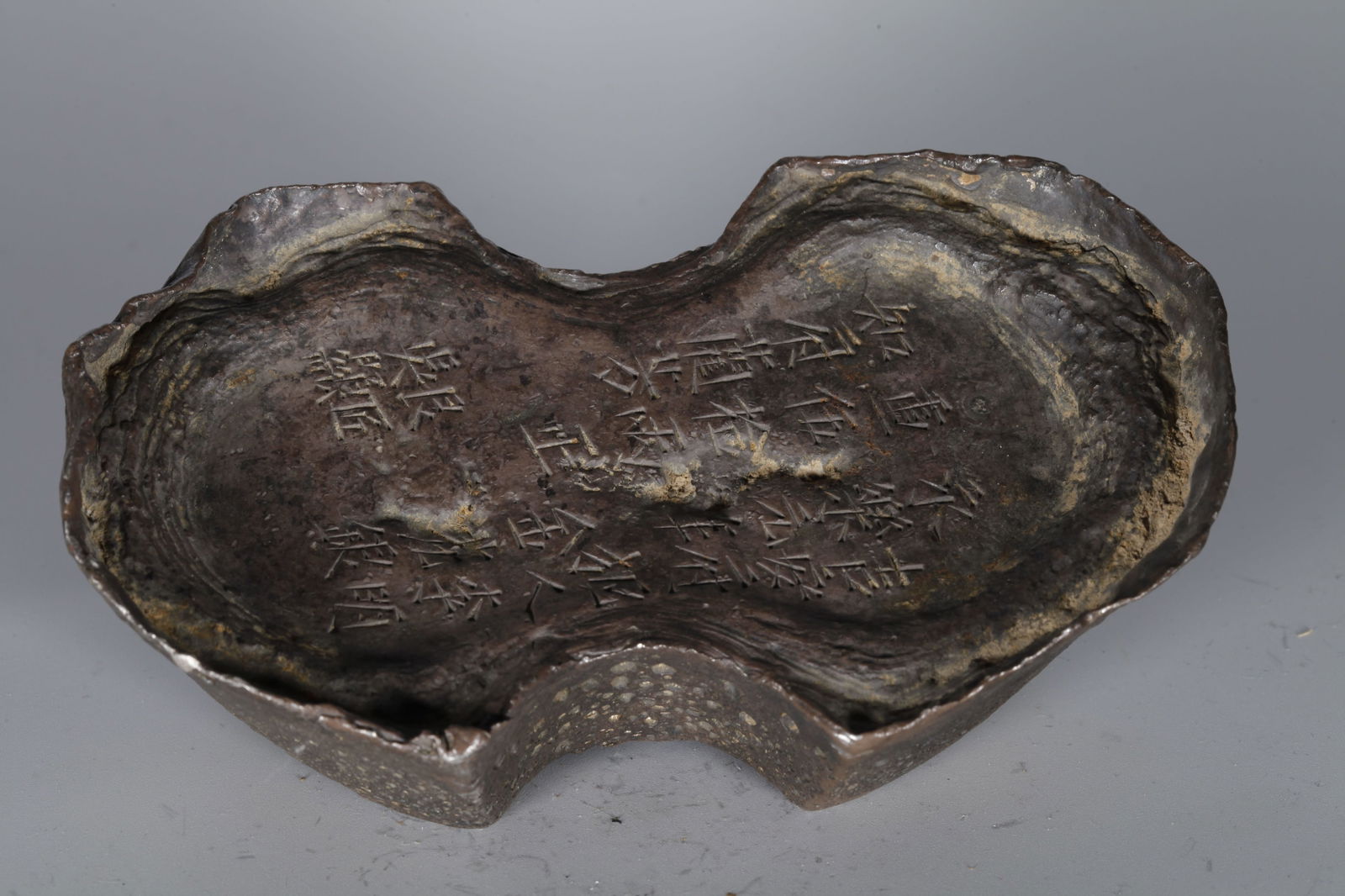 A SILVER INGOT (FIFTY TAELS) (1 of 7)