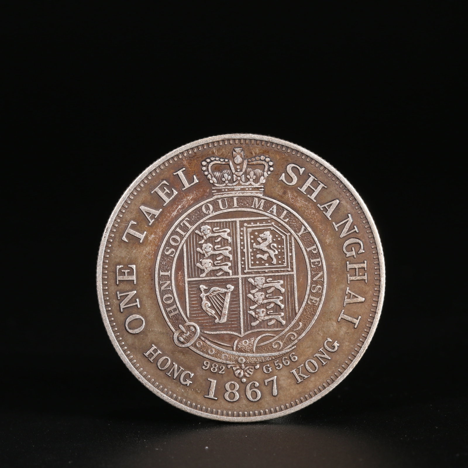 A SILVER DOLLAR COIN: One Silver dollar Coin