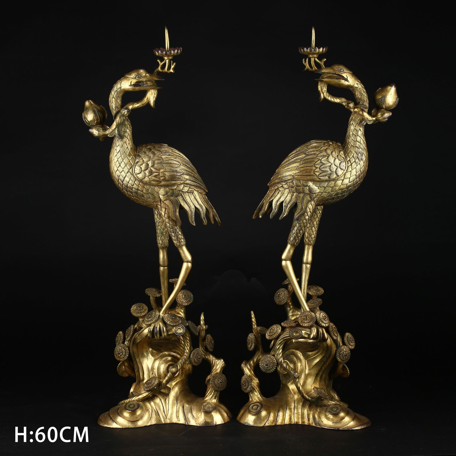 A GILDED BRONZE SET OF CRANE-SHAPED CANDLEHOLDERS (1 of 10)