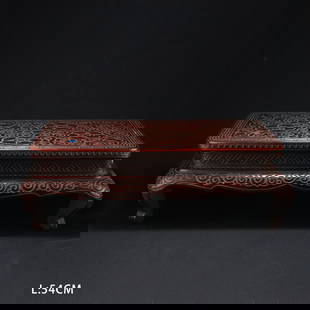 A CARVED RHINOCEROS HORN SCROLL AND GRASS PATTERN LOW TABLE: Carved Rhinoceros Horn Scroll and Grass Pattern Low Table