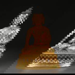 A GILDED BRONZE STATUE OF SHAKYAMUNI BUDDHA: Gilded bronze statue of Shakyamuni Buddha