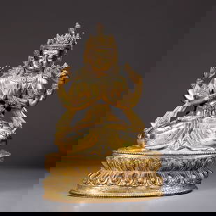 A GILT BRONZE FOUR-ARMED GUANYIN STATUE: Gilt Bronze Four-Armed Guanyin Statue