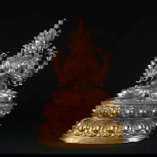 A GILT BRONZE FOUR-ARMED GUANYIN STATUE: Gilt bronze four-armed Guanyin statue