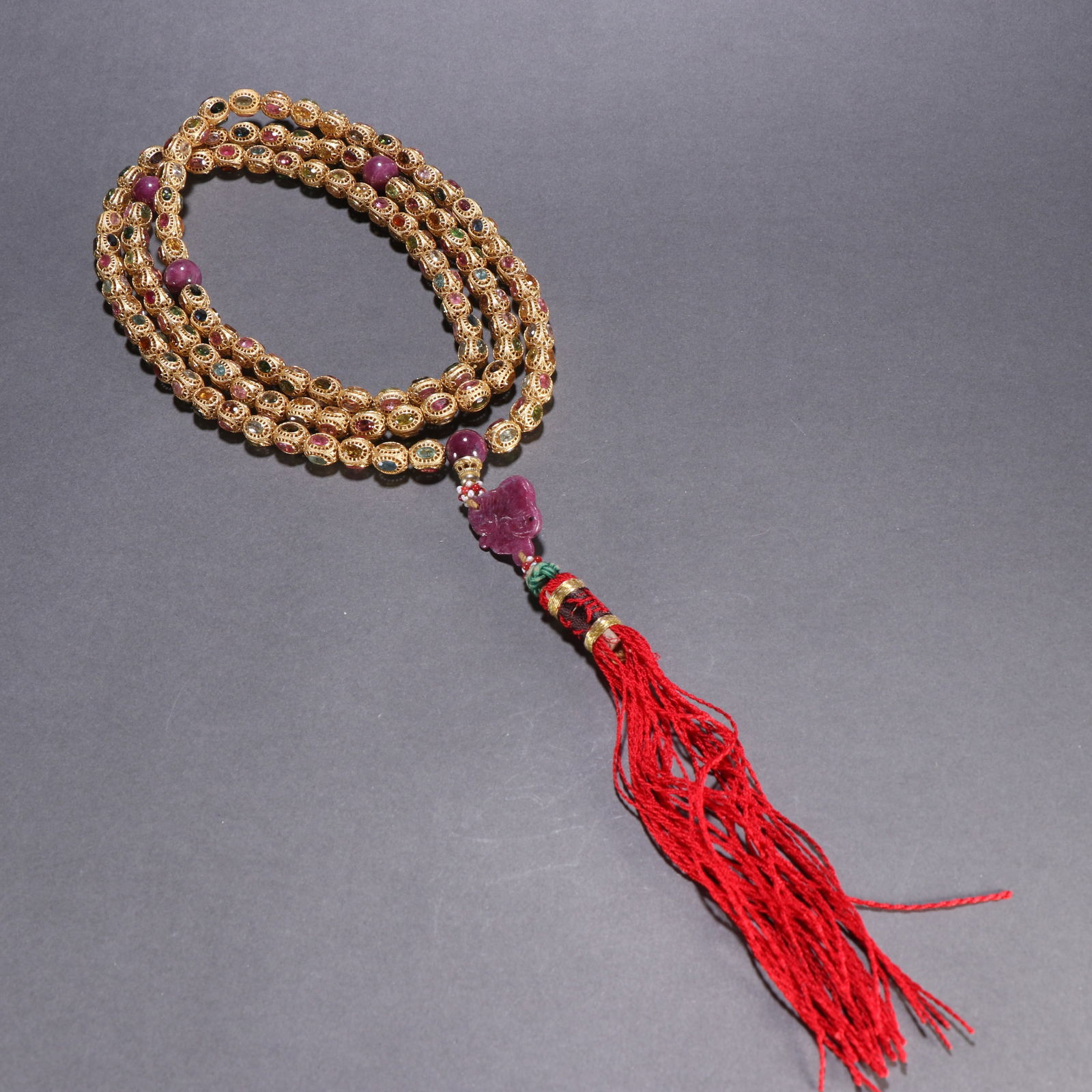 A QING DYNASTY SILVER GILT TOURMALINE-INLAID 108-BEAD BUDDHIST ROSARY (1 of 9)