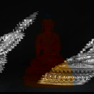 A GILT BRONZE FIGURE OF SHAKYAMUNI BUDDHA: Gilt Bronze Figure of Shakyamuni Buddha