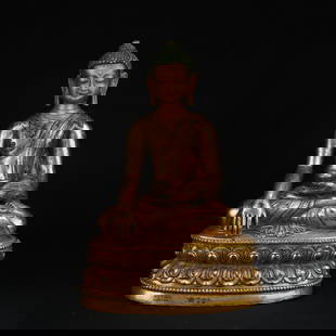 A GILT BRONZE FIGURE OF SHAKYAMUNI BUDDHA: Gilt Bronze Figure of Shakyamuni Buddha