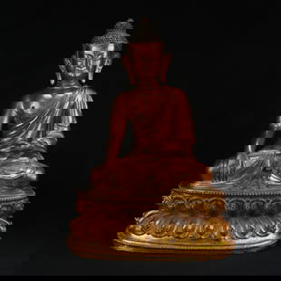 A GILT BRONZE FIGURE OF SHAKYAMUNI BUDDHA: Gilt Bronze Figure of Shakyamuni Buddha