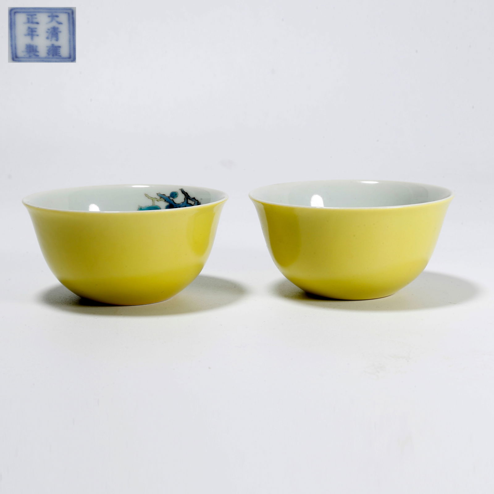 A PAIR OF YELLOW GLAZE CUPS WITH FLOWER AND BIRD MOTIF: Pair of yellow glaze cups with flower and bird motif