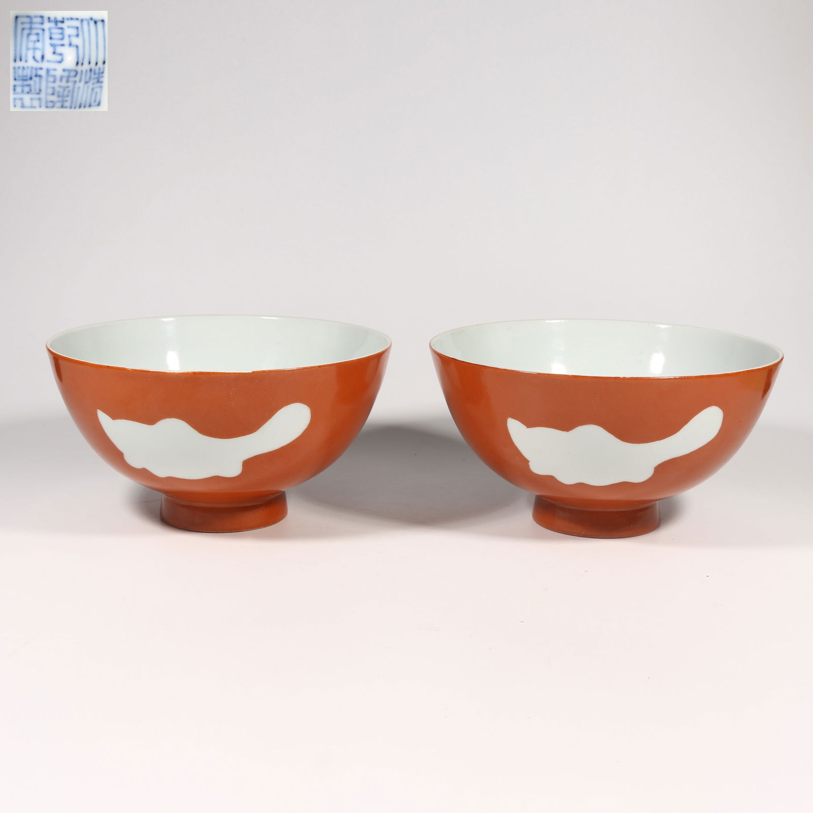 A GROUP OF CORAL RED-GLAZED CHICKEN HEART BOWLS WITH RESERVED THREE-FISH DESIGN: Group of coral red-glazed chicken heart bowls with reserved three-fish design