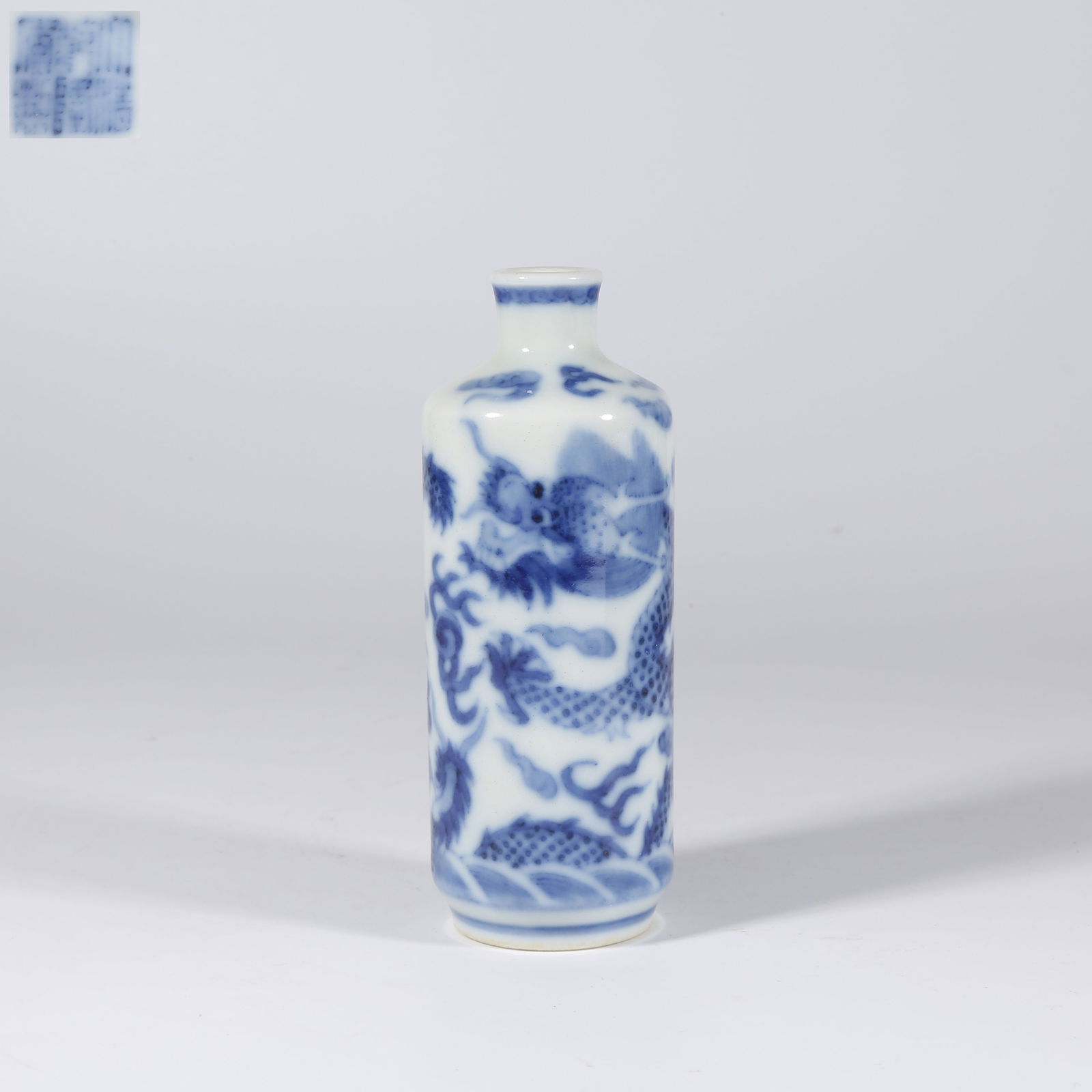A BLUE AND WHITE SNUFF BOTTLE WITH CLOUD-AND-DRAGON DESIGN: Blue and White Snuff Bottle with Cloud-and-Dragon Design