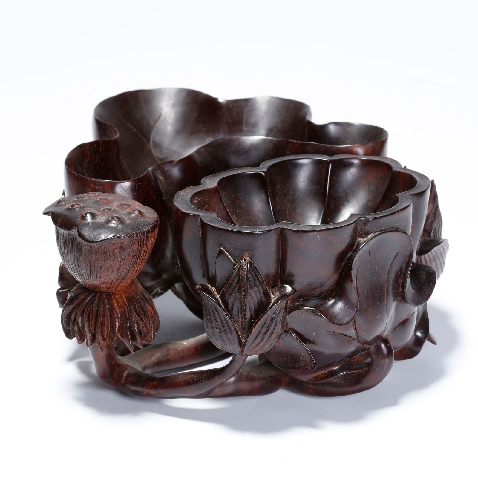 A ZITAN WOOD CARVED TWIN LOTUS-SHAPED WATER COUPES: Zitan Wood Carved Twin Lotus-Shaped Water Coupes