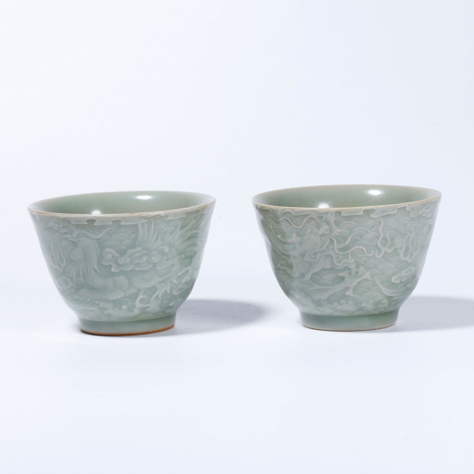 A LONGQUAN KILN SEA DRAGON PATTERN CUPS (PAIR) (1 of 9)