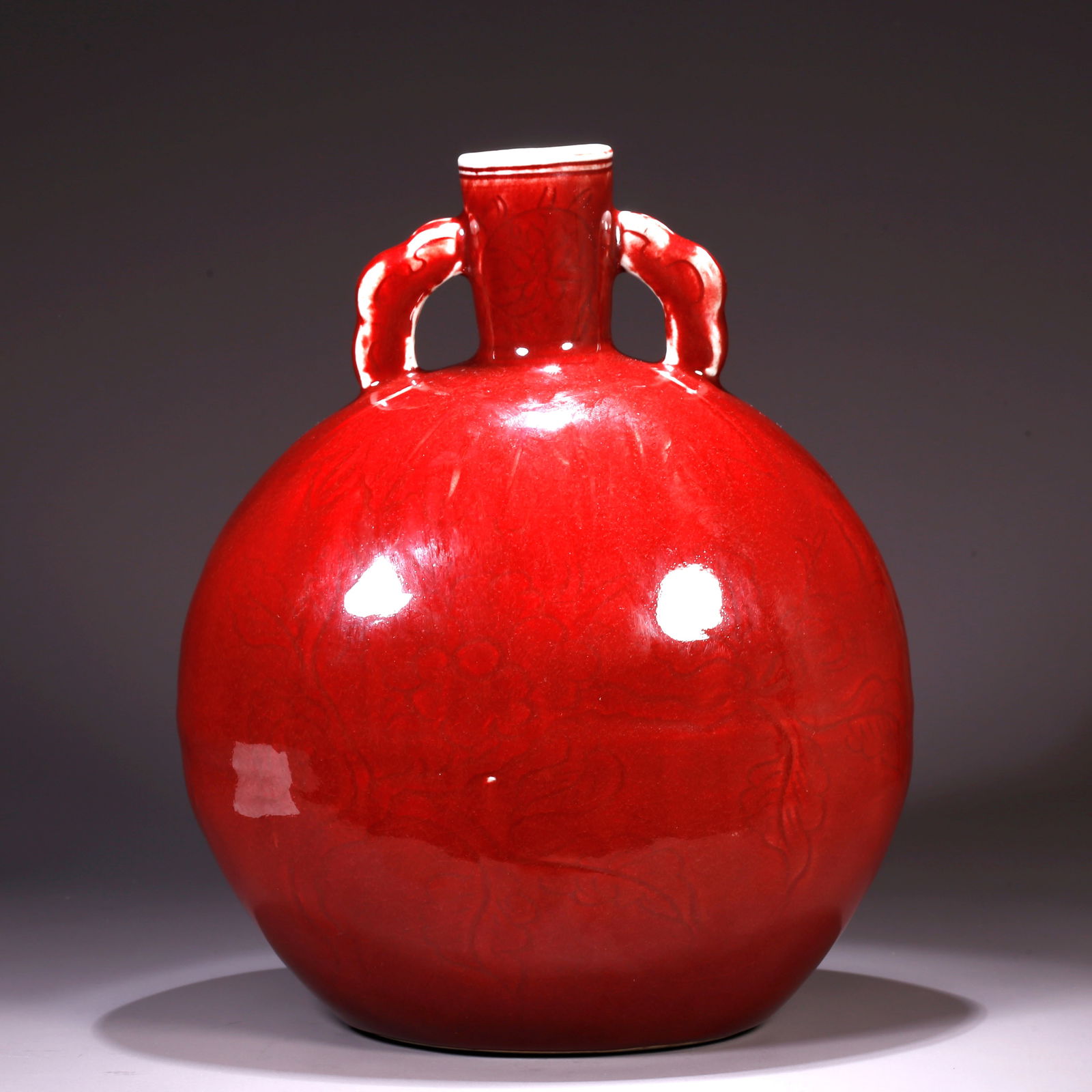 A RED-GLAZED MOONFLASK: Red-Glazed Moonflask