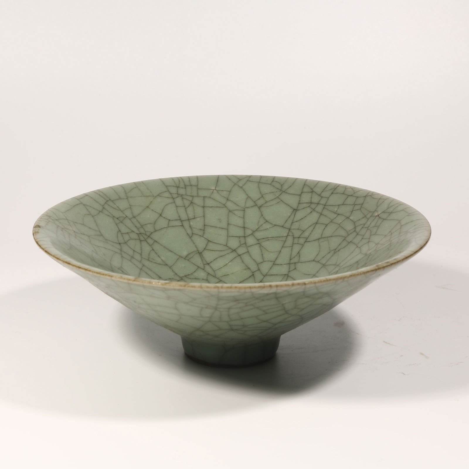 A LONGQUAN KILN DOULI-SHAPED TEA CUP: Longquan Kiln Douli-Shaped Tea Cup