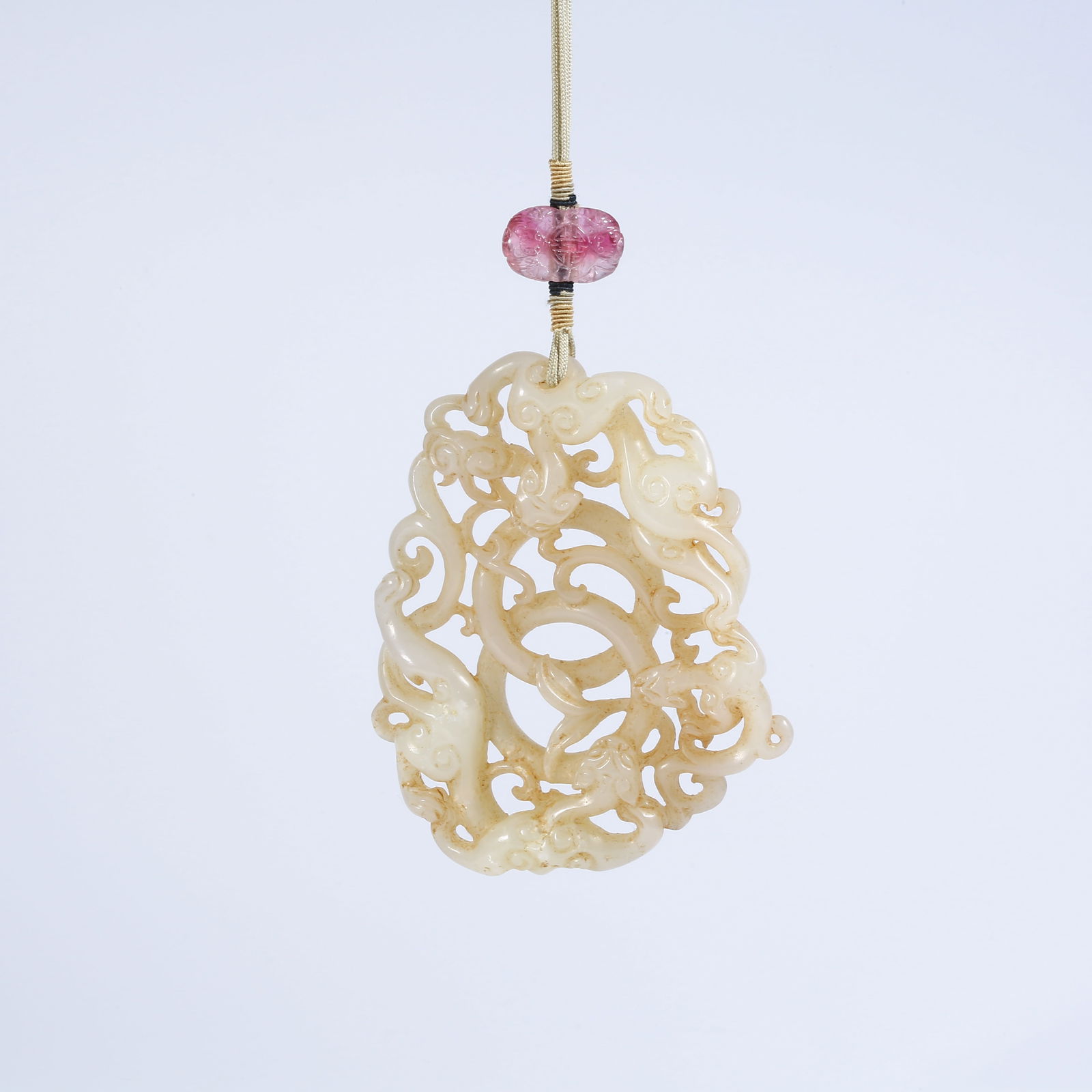 A HETIAN WHITE JADE PENDANT WITH CHI-DRAGON MOTIF (1 of 7)