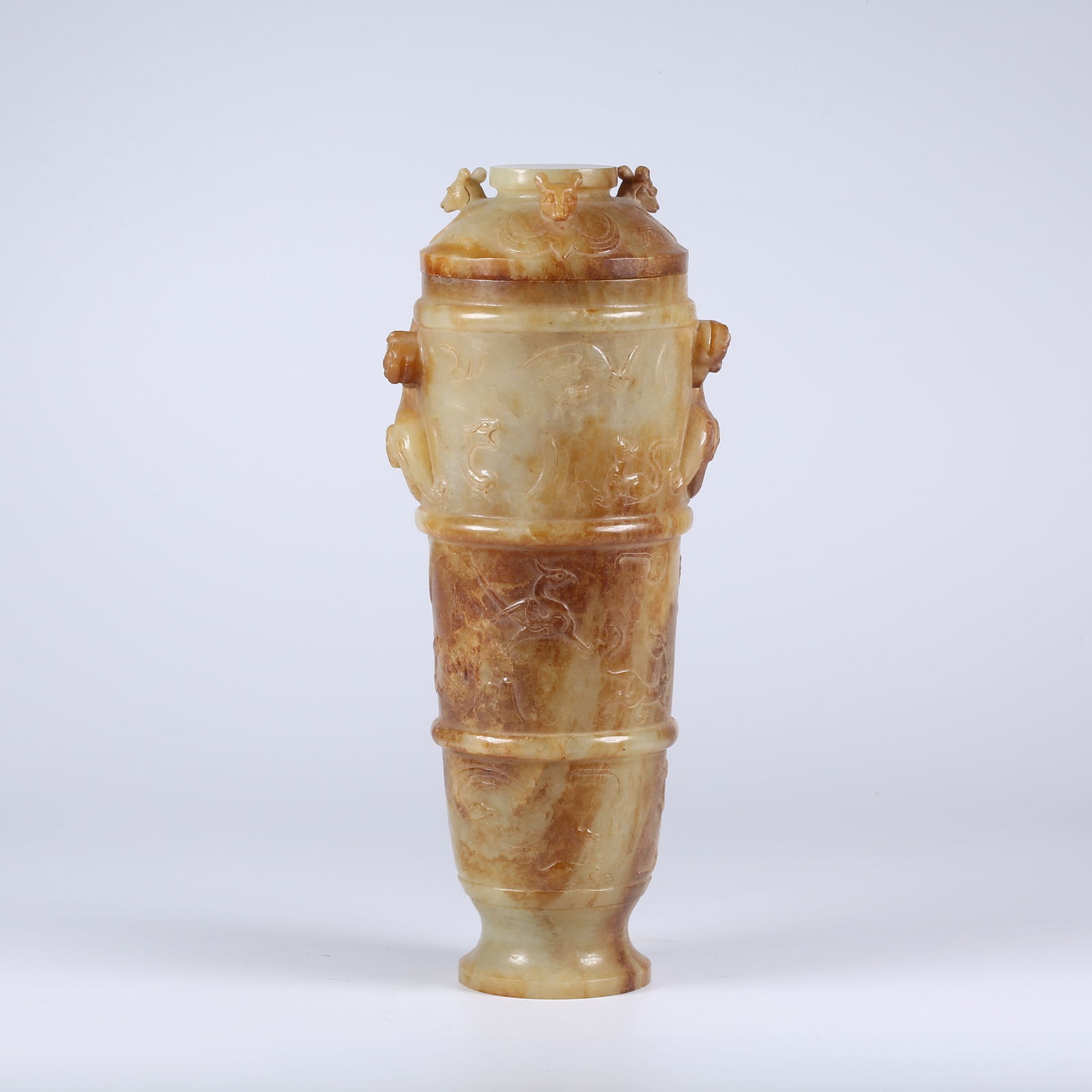 A ARCHAIC JADE COVERED GOBLET WITH AUSPICIOUS BEAST PATTERN: Archaic Jade Covered Goblet with Auspicious Beast Pattern