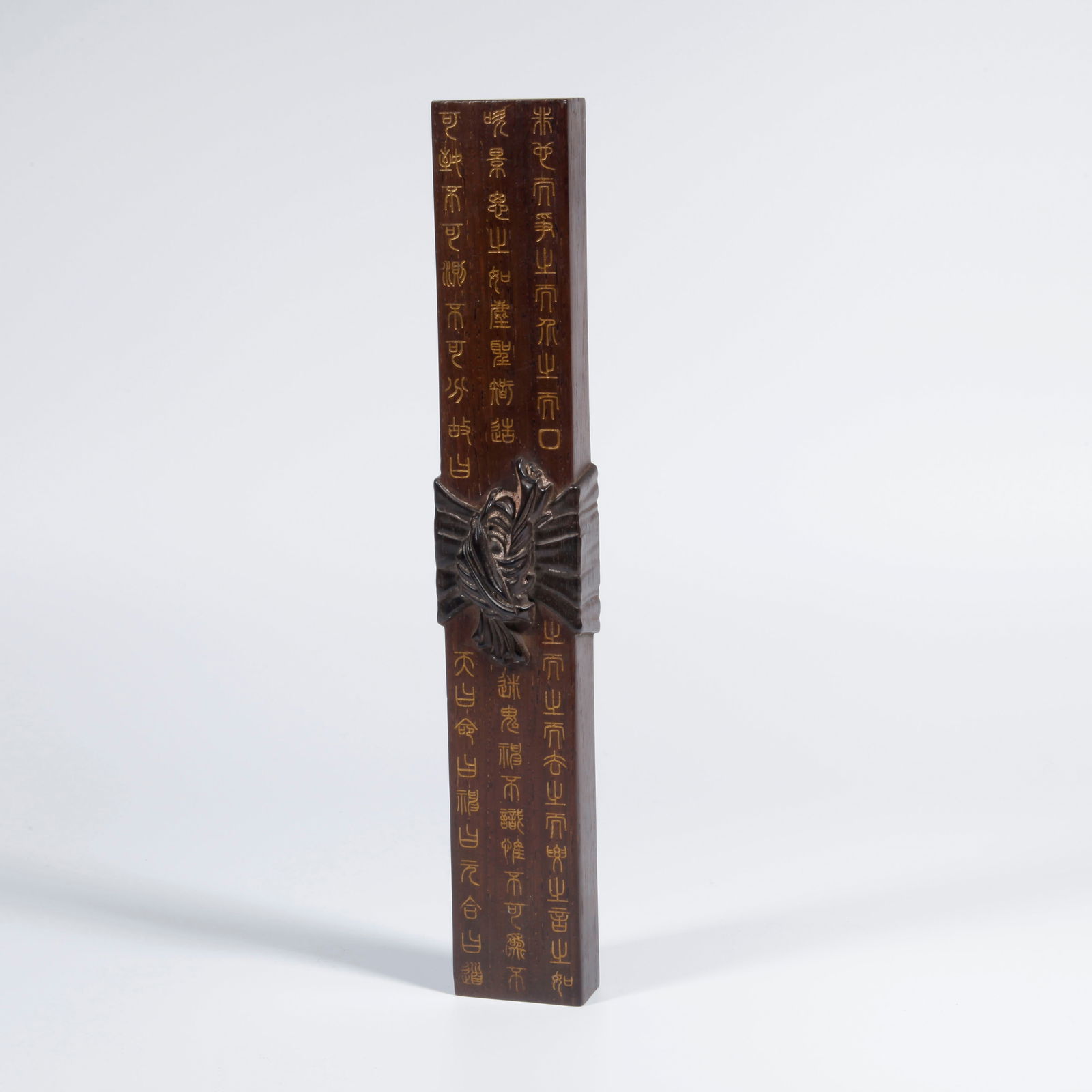 A HUANGHUALI WOOD CARVING GILDED INSCRIBED PAPERWEIGHT: Huanghuali Wood Carving Gilded Inscribed Paperweight