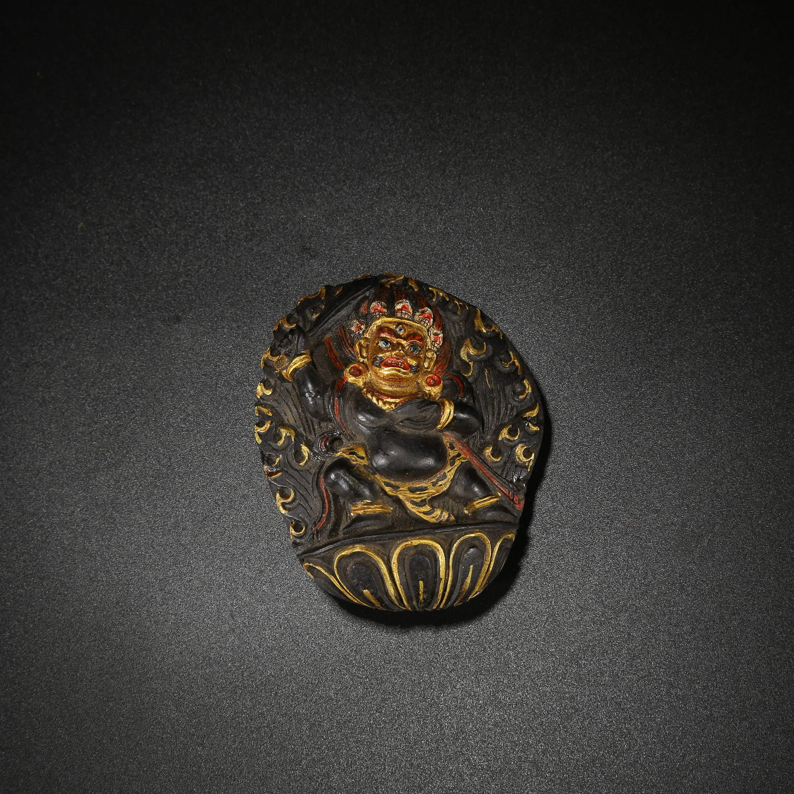 A FOSSIL CONCH WITH POLYCHROME BUDDHA STATUE: Fossil Conch with Polychrome Buddha Statue