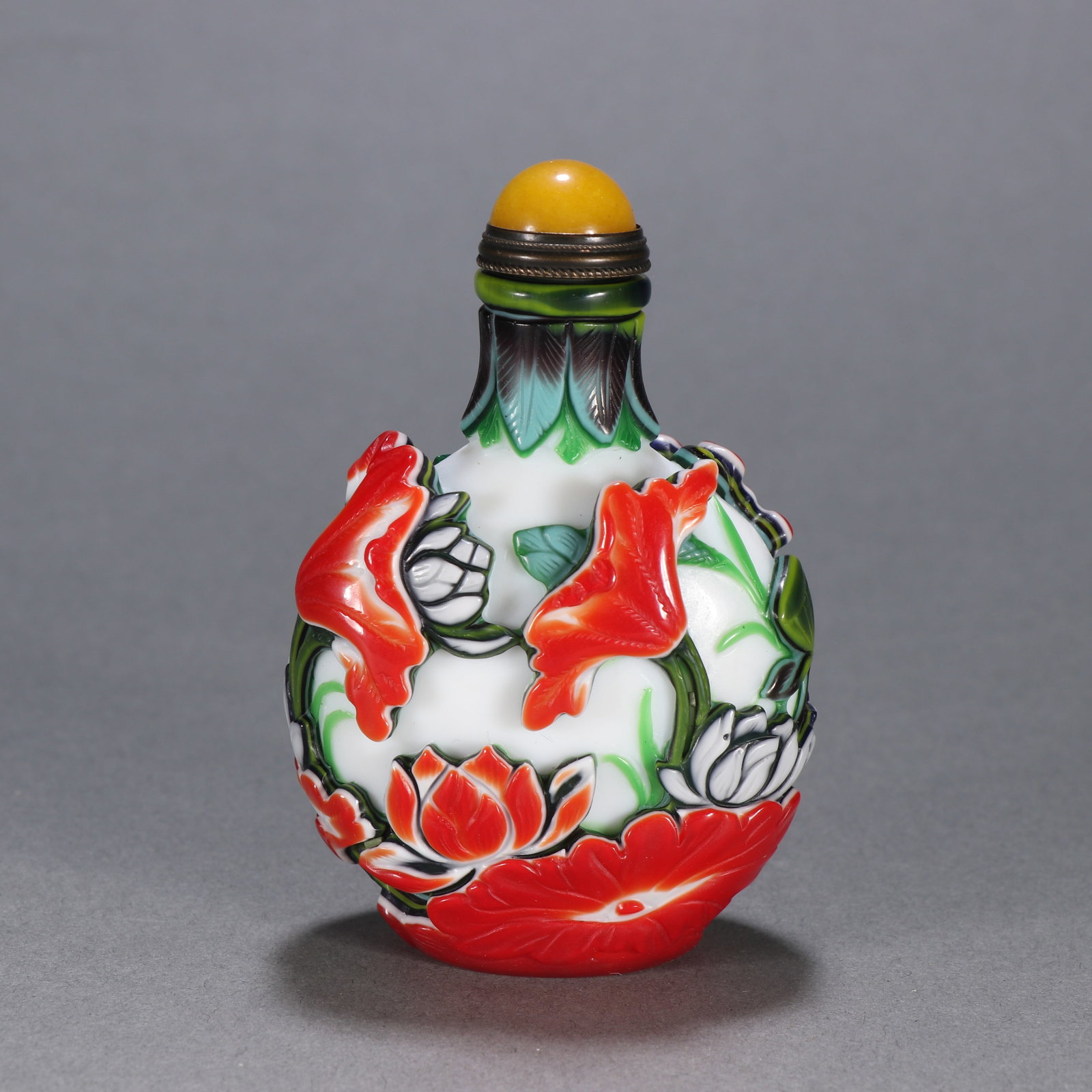 A PORCELAIN-OVERLAID SNUFF BOTTLE CONTINUOUS LOTUS LEAVES (1 of 9)