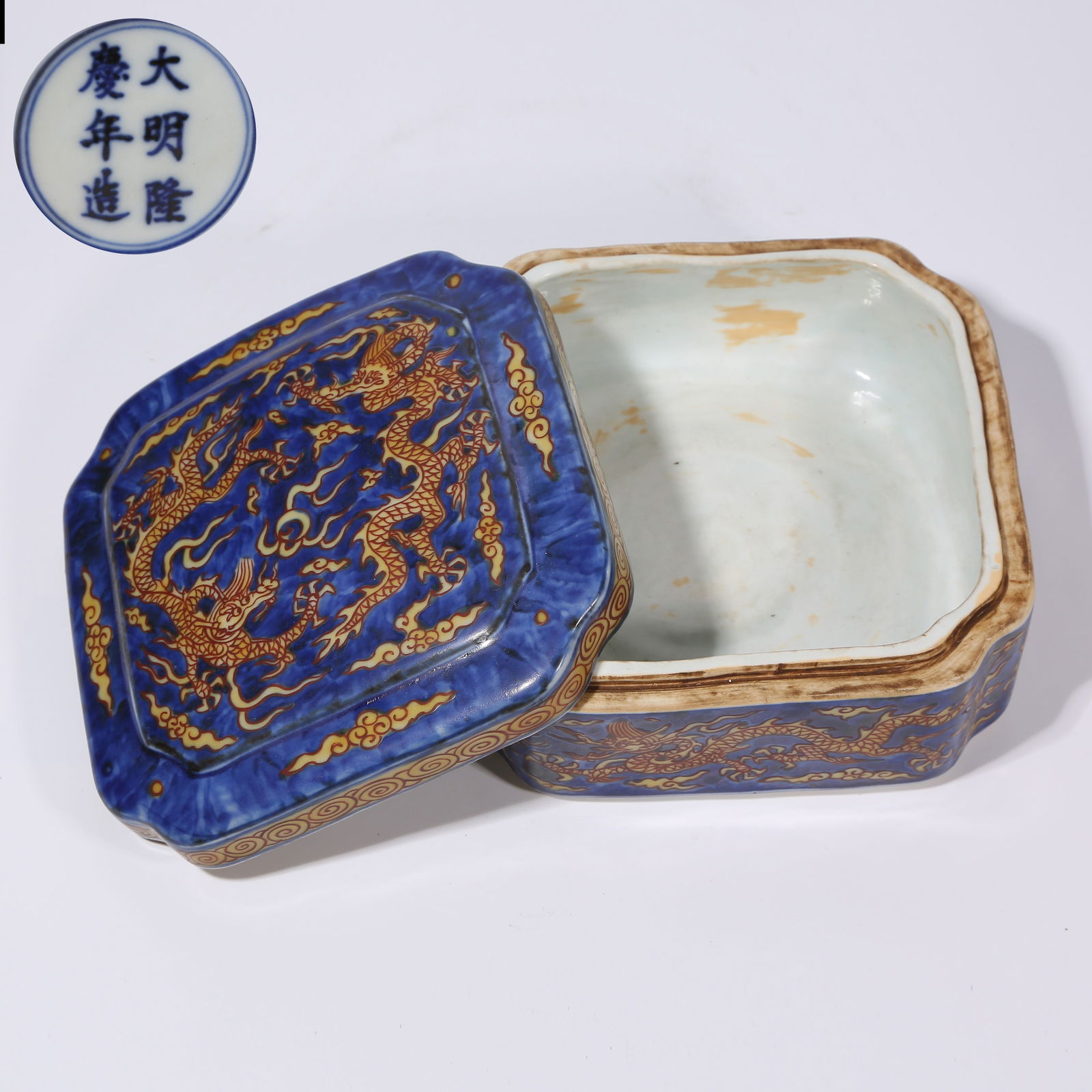 A BLUE-GROUND YELLOW-ENAMEL SQUARE CASKET WITH TWO DRAGONS PLAYING WITH A PEARL DESIGN: Blue-Ground Yellow-Enamel Square Casket with Two Dragons Playing with a Pearl Design