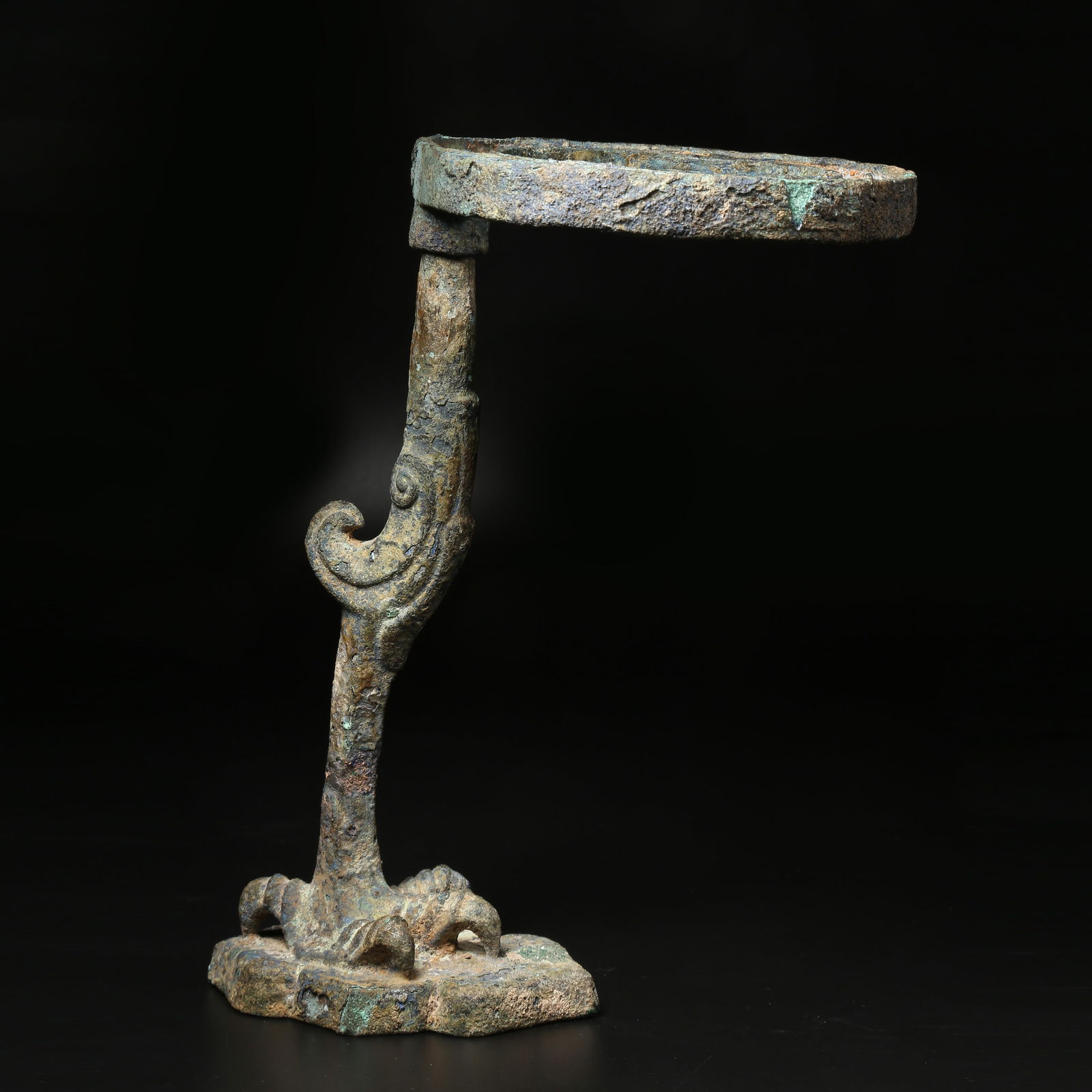 A BRONZE CANDLESTICK: Bronze Candlestick