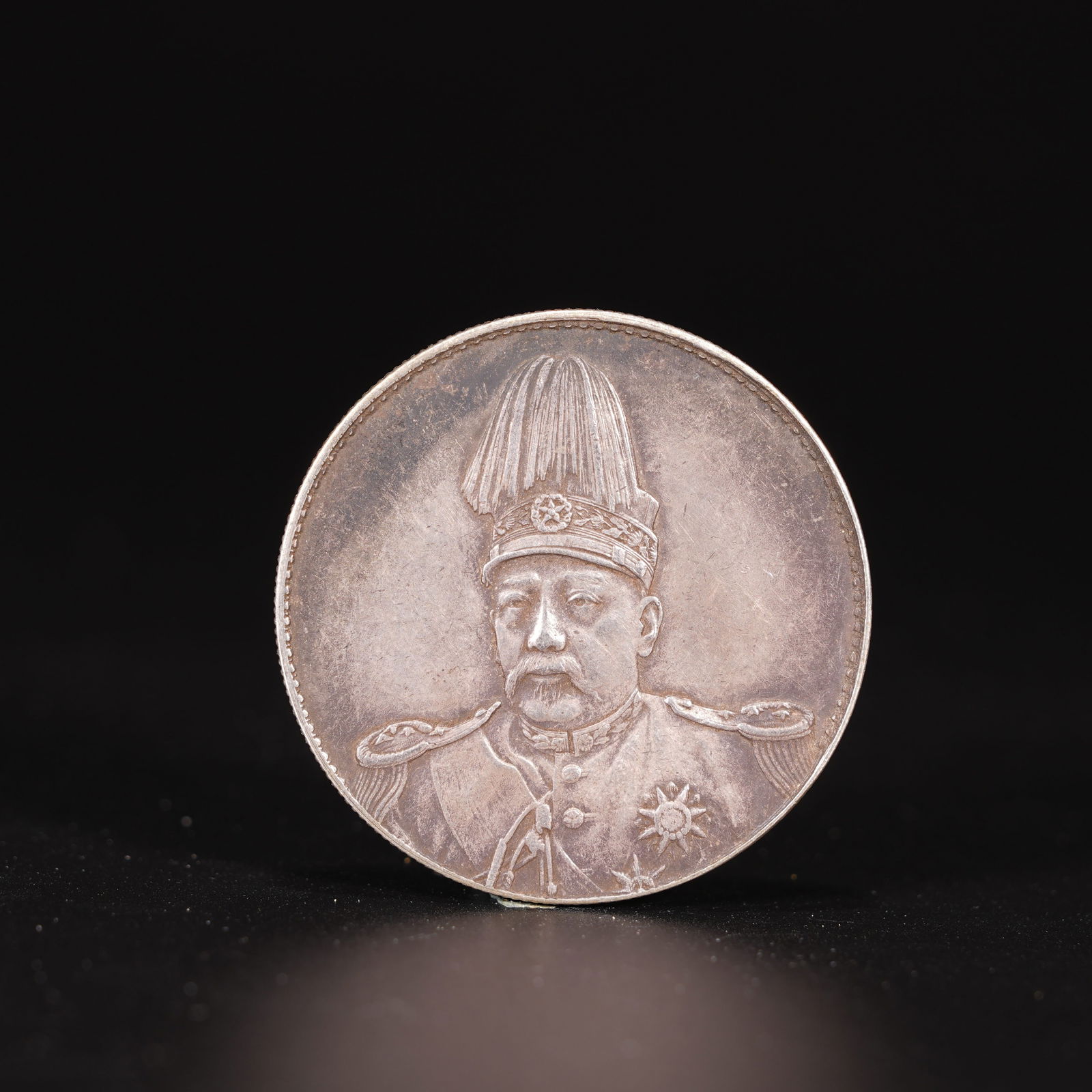 A SILVER DOLLAR COIN: One Silver dollar Coin