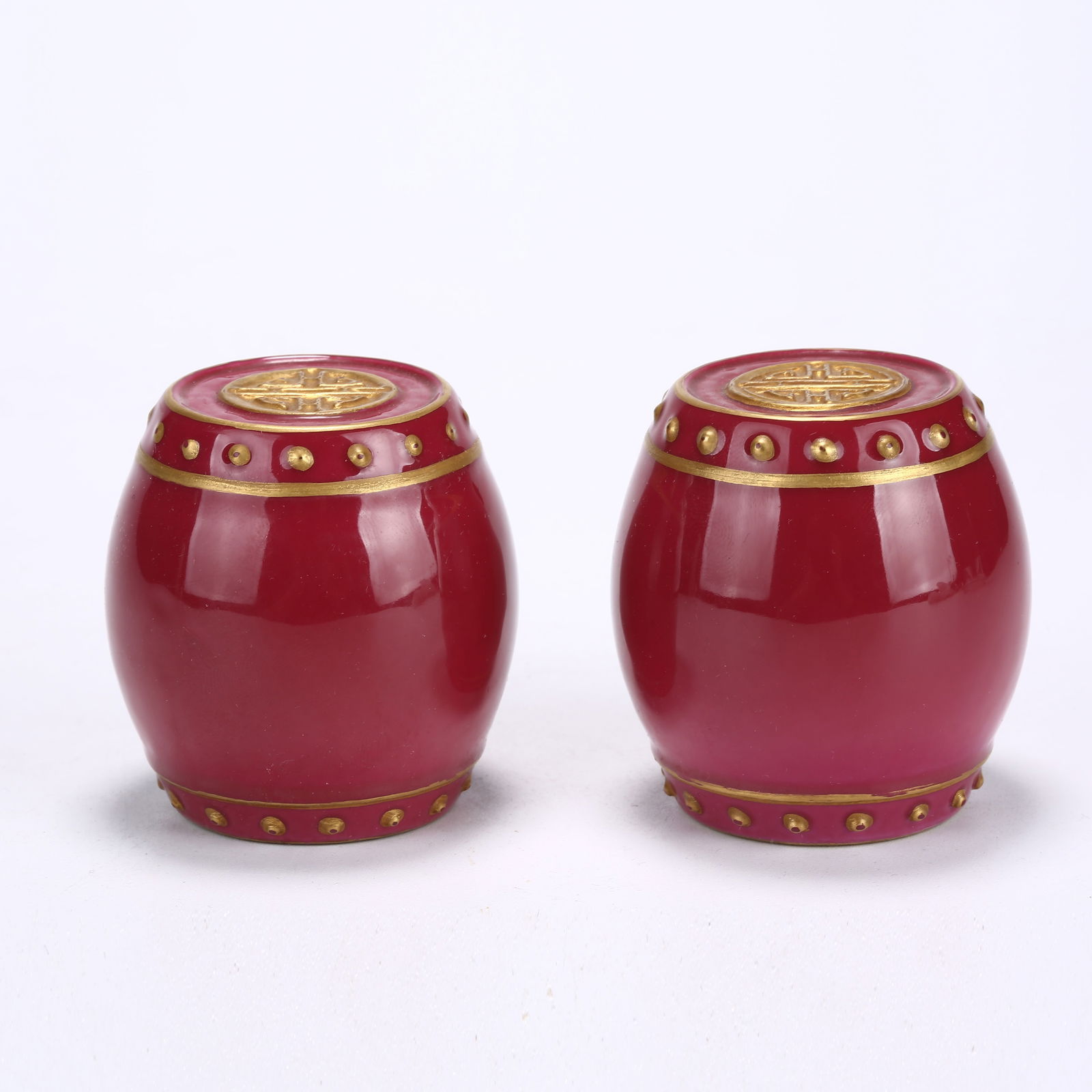 A ROSE-PINK GLAZED DRUM-SHAPED PAPERWEIGHT: Rose-Pink Glazed Drum-Shaped Paperweight