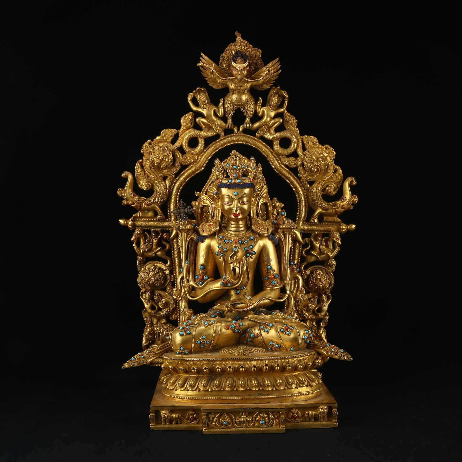 A GILT BRONZE BUDDHA STATUE INLAID WITH GEMSTONES: Gilt bronze Buddha statue inlaid with gemstones