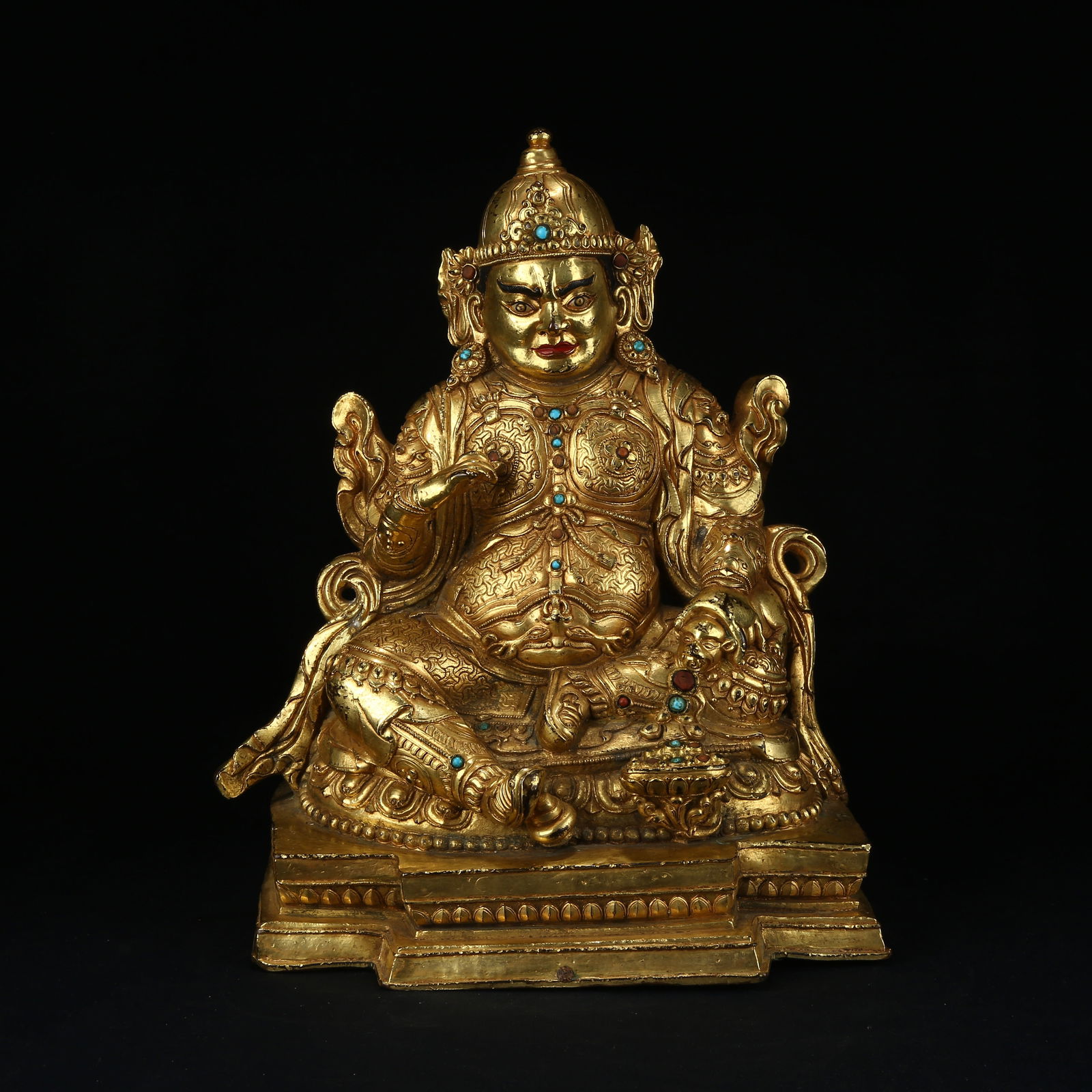 A GILT BRONZE YELLOW JAMBHALA STATUE INLAID WITH GEMSTONES: Gilt bronze Yellow Jambhala statue inlaid with gemstones